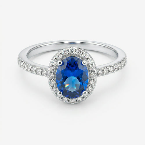 Anel Ivel em prata 925 com zircônia oval azul em halo de zircônias brancas e aro fino cravejado, vista frontal